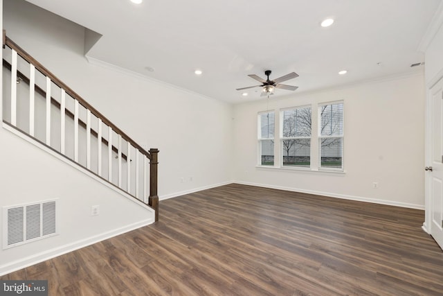 unfurnished living room with dark hardwood / wood-style flooring, ceiling fan, and ornamental molding