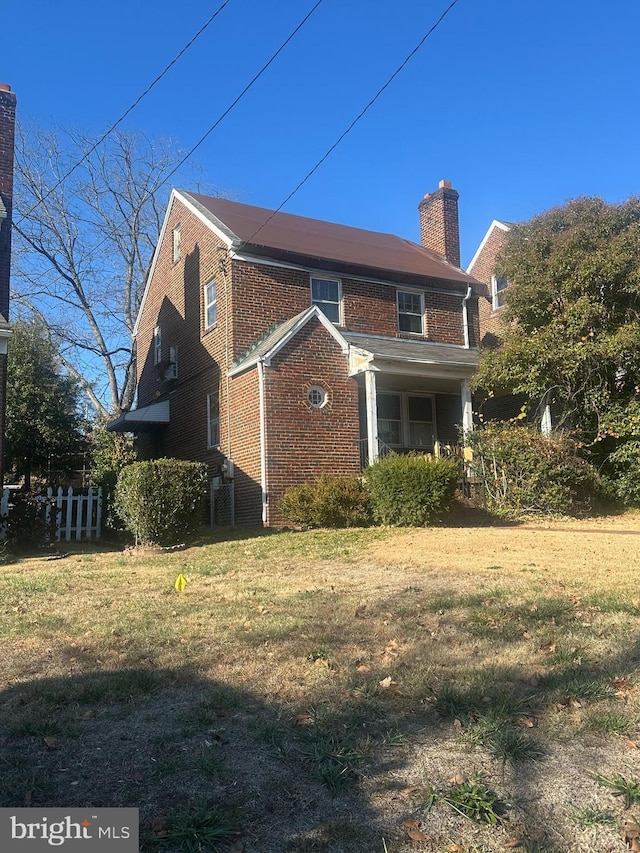 view of home's exterior with a lawn