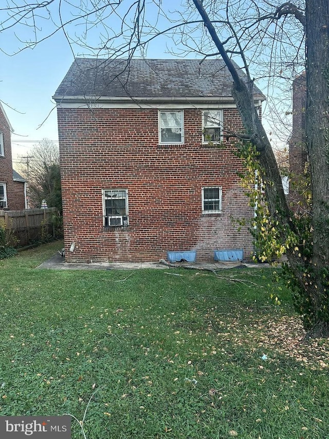 view of property exterior featuring a lawn