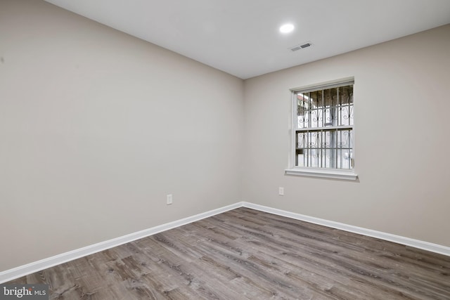 spare room featuring hardwood / wood-style flooring