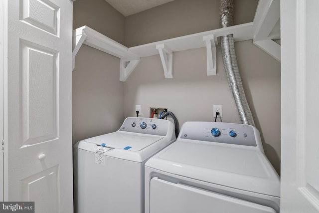 laundry area with independent washer and dryer