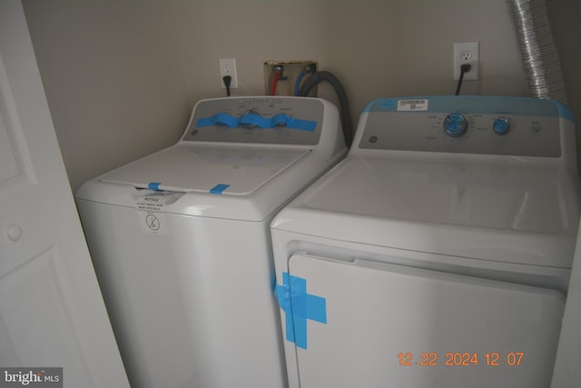 laundry area with independent washer and dryer