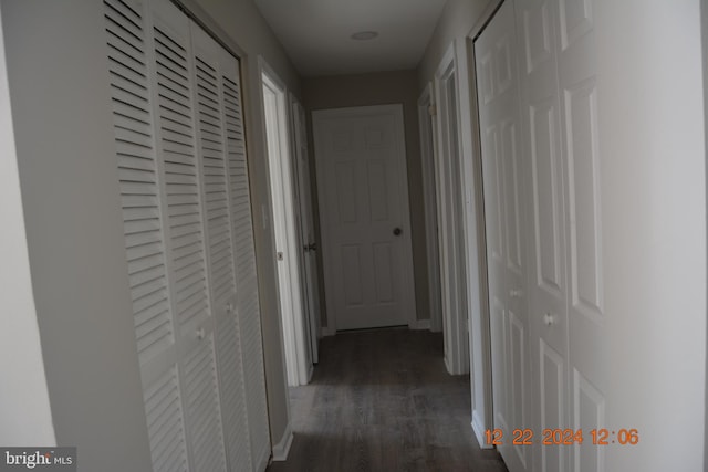 hallway featuring dark hardwood / wood-style flooring