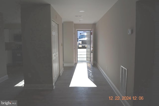 hall with dark hardwood / wood-style flooring