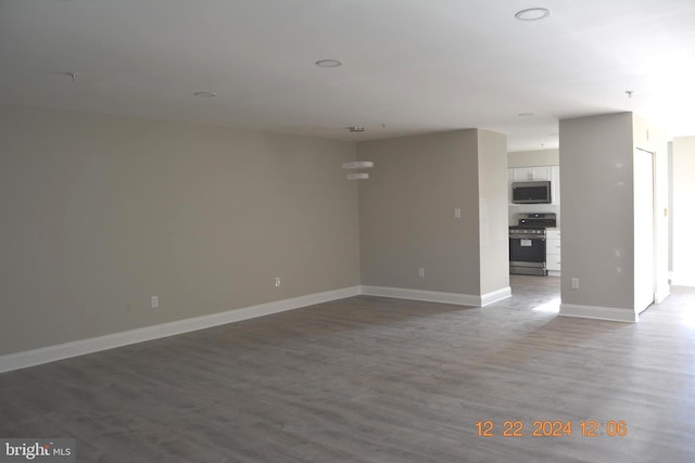 spare room with hardwood / wood-style flooring