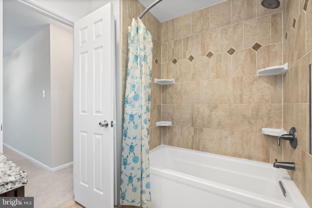 bathroom with shower / bathtub combination with curtain and vanity