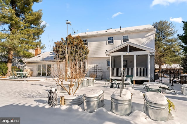 back of house featuring a patio and a sunroom