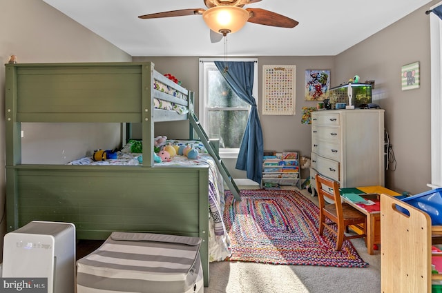 bedroom with ceiling fan and carpet