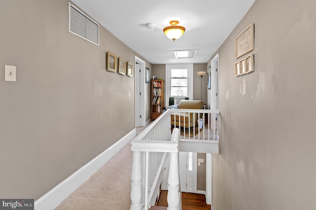 hall featuring carpet