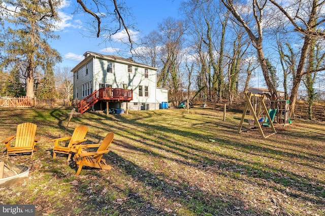 view of yard featuring a playground and a deck