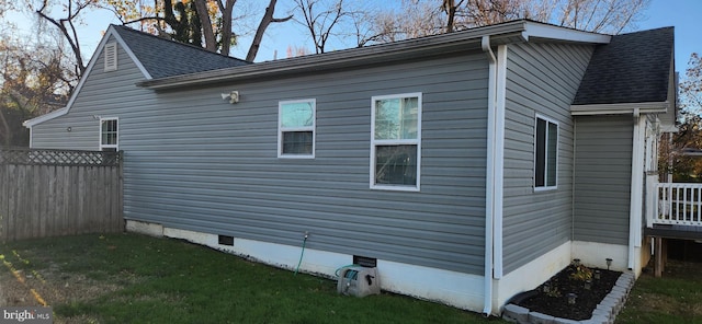 view of property exterior with a yard