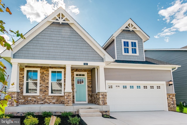 craftsman-style home with a garage and covered porch