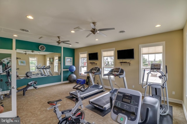 workout area featuring carpet flooring and ceiling fan