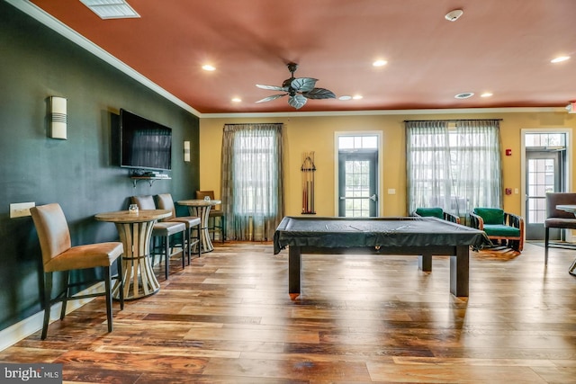 rec room with light hardwood / wood-style flooring, ceiling fan, ornamental molding, and pool table