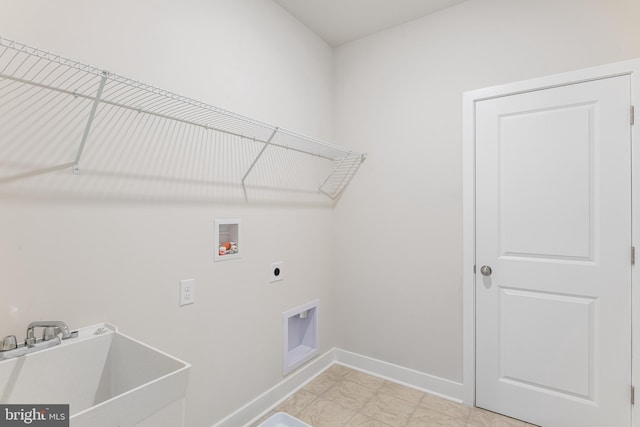 clothes washing area featuring hookup for an electric dryer, light tile patterned flooring, sink, and hookup for a washing machine