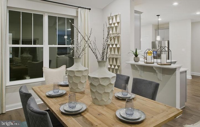 dining room with dark wood-type flooring