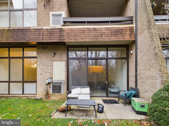 entrance to property featuring a patio