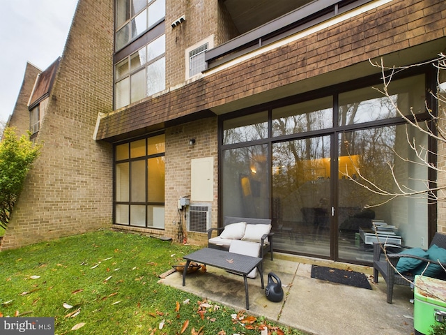 back of house with a lawn and a patio area