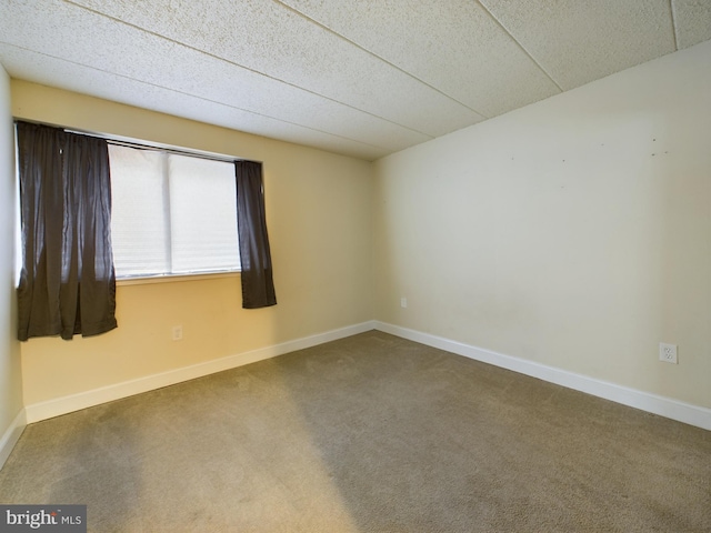 unfurnished room with carpet flooring