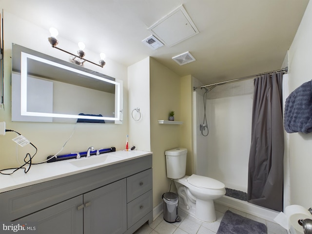 bathroom featuring vanity, toilet, tile patterned floors, and a shower with curtain