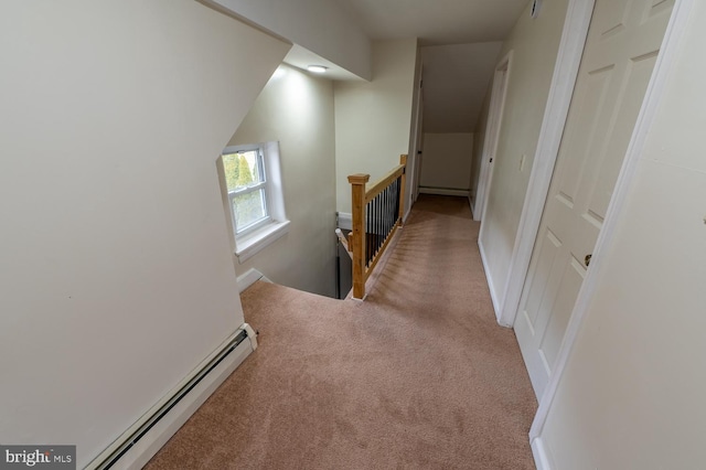 hall with light carpet and a baseboard radiator