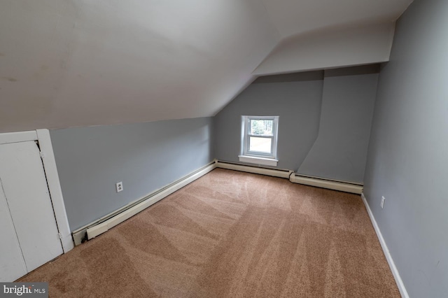 bonus room with light carpet, vaulted ceiling, and baseboard heating