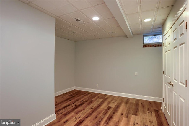 empty room featuring recessed lighting, wood finished floors, visible vents, and baseboards