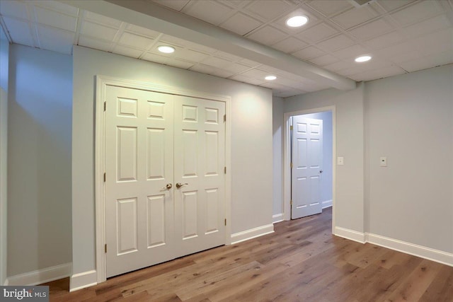 interior space featuring recessed lighting, light wood-style flooring, and baseboards