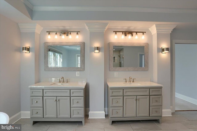 full bath with a shower, ornamental molding, two vanities, and a sink