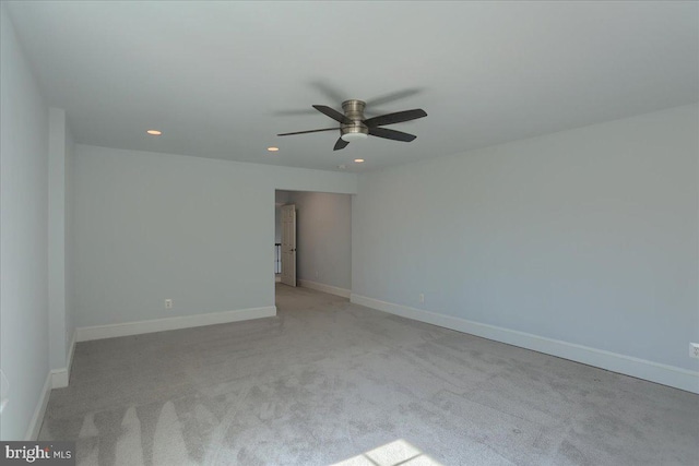 unfurnished room featuring light carpet, ceiling fan, recessed lighting, and baseboards