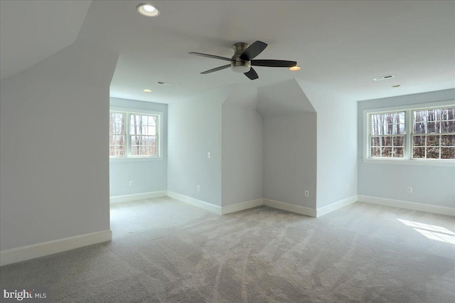 additional living space with baseboards, carpet floors, visible vents, and recessed lighting