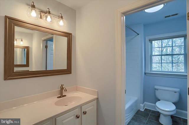 bathroom with visible vents, toilet, vanity, tile patterned flooring, and baseboards