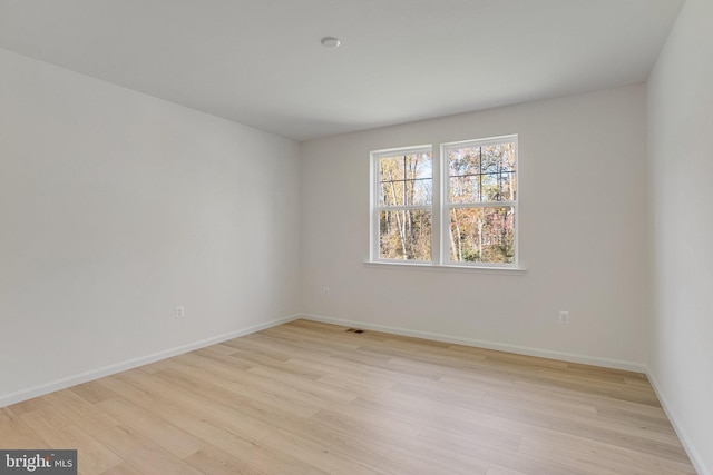 empty room with light wood-type flooring