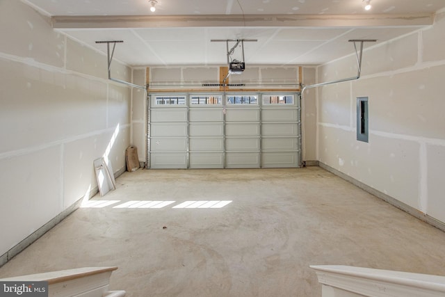 garage featuring electric panel and a garage door opener