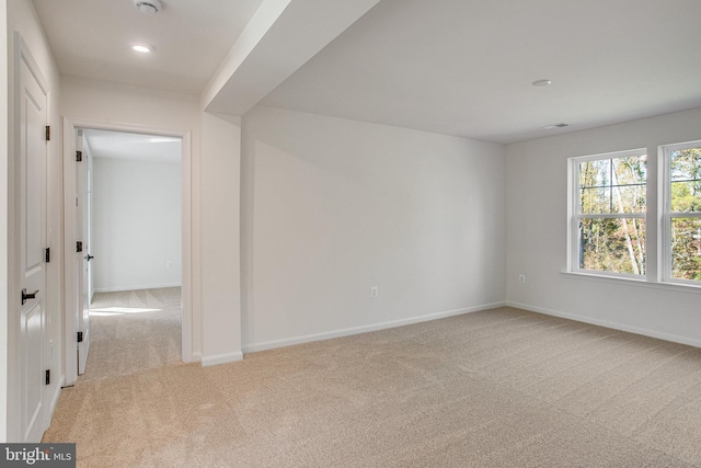 empty room featuring light colored carpet