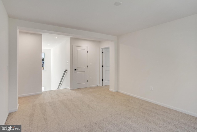 empty room featuring light colored carpet