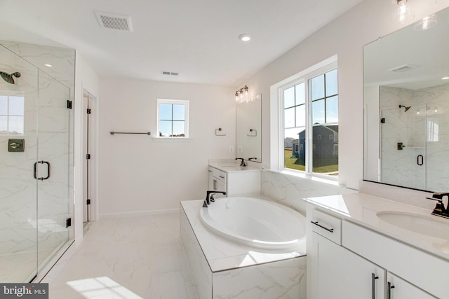 bathroom with independent shower and bath, vanity, and a healthy amount of sunlight