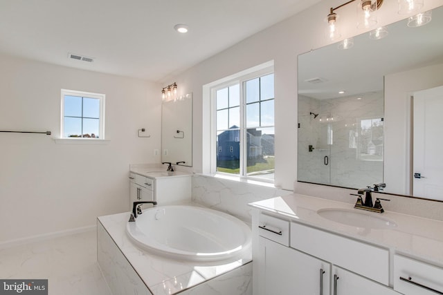 bathroom featuring plus walk in shower and vanity