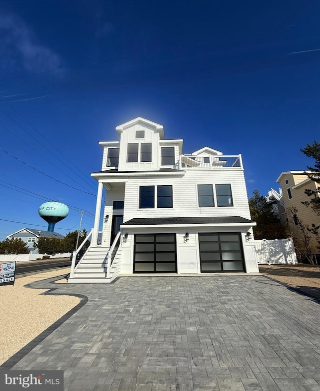 view of front of house with a balcony and a garage