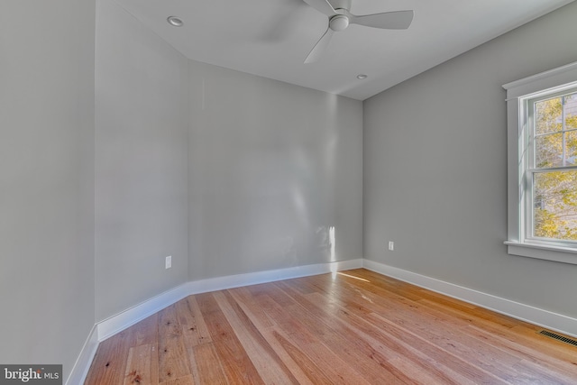 empty room featuring ceiling fan and light hardwood / wood-style floors