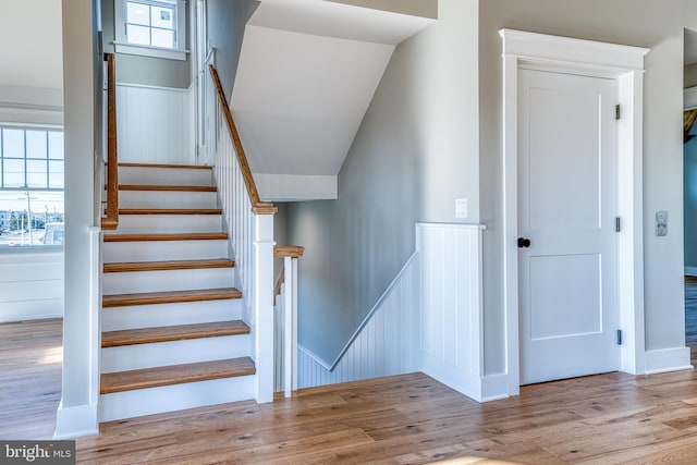 stairway with hardwood / wood-style flooring