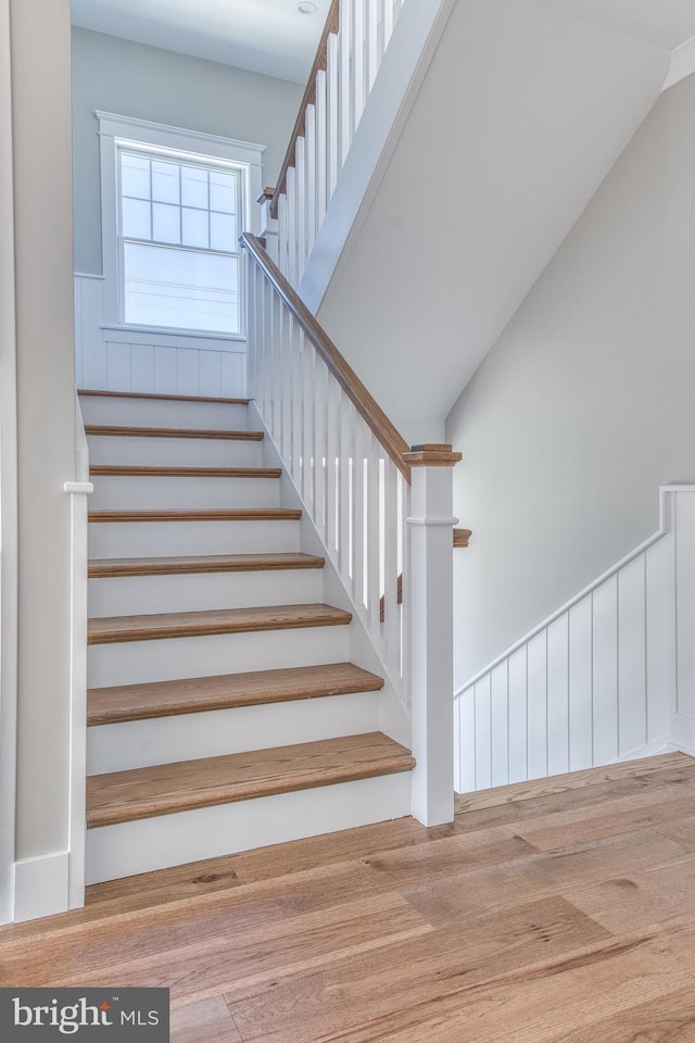 stairway featuring hardwood / wood-style floors