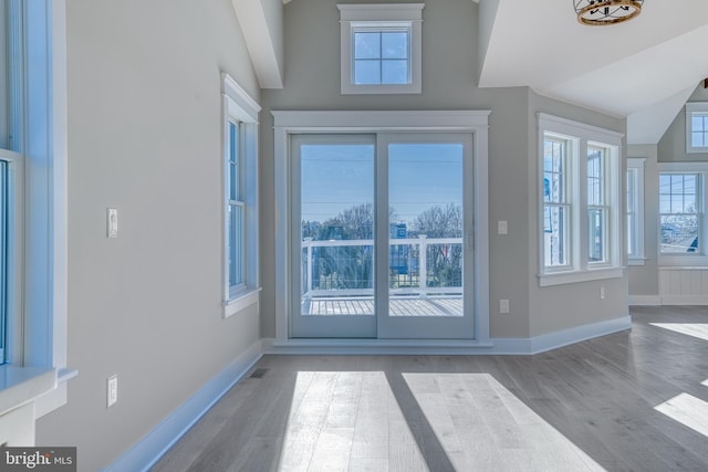 doorway to outside with light hardwood / wood-style floors