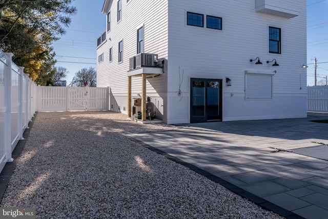 back of house featuring a patio and central AC