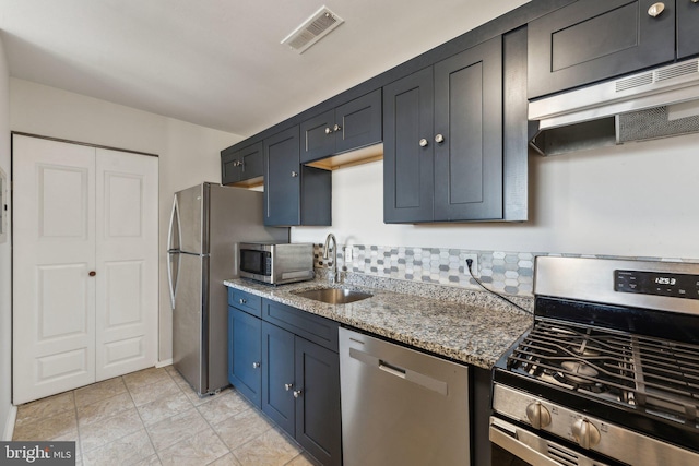 kitchen featuring sink, light stone countertops, extractor fan, and appliances with stainless steel finishes