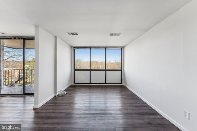 unfurnished room featuring dark hardwood / wood-style flooring