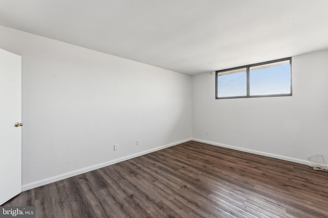 empty room featuring dark wood-type flooring