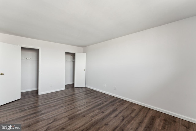 unfurnished bedroom featuring dark wood-type flooring