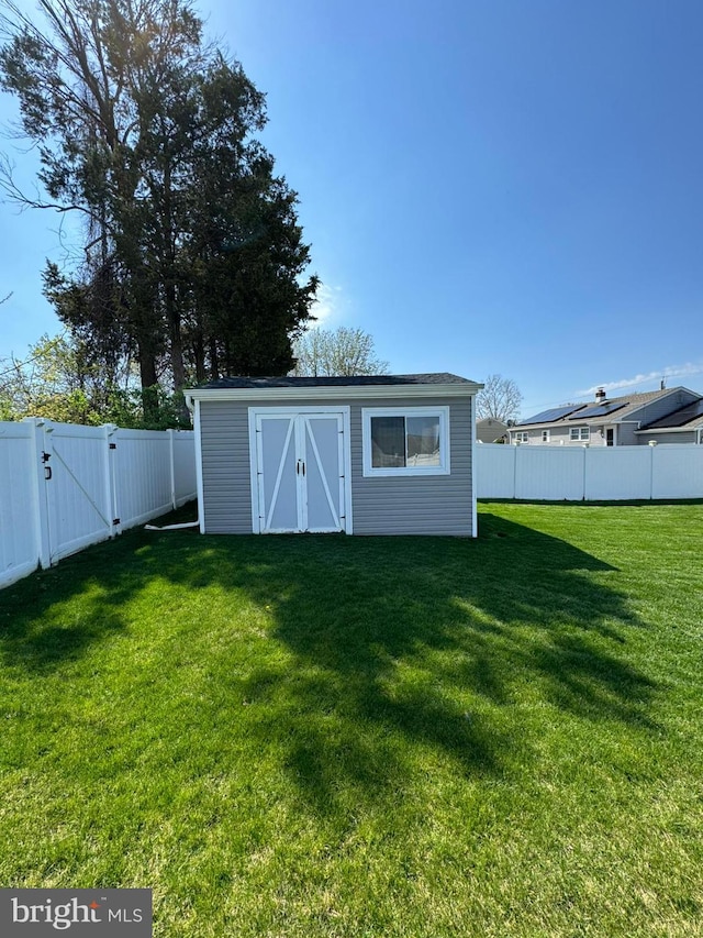 view of outdoor structure featuring a lawn