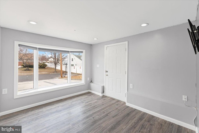 spare room with hardwood / wood-style floors